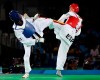 FILE - In this Aug. 17, 2016, file photo, Luisito Pie, of the Dominican Republic, left, and Jesus Tortosa, of Spain, compete in a men's Taekwondo bronze medal final at the 2016 Summer Olympics in Rio de Janeiro, Brazil, Wednesday, Aug. 17, 2016. One of the world's top-ranked taekwondo fighters is taking vacation in the Dominican Republic instead of competing at the Tokyo Olympics after being surprisingly excluded from the Games by the Spanish federation. Tortosa is among a few athletes worldwide who earned Olympic qualification but won’t be in Japan because in some sports the final decision on picking the teams is made by the local federations. (AP Photo/Andrew Medichini, File)