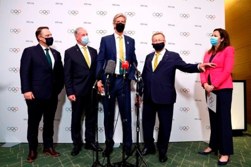 The Right Honourable the Lord Mayor of Brisbane, Councillor Adrian Schrinner, Senator the Honourable Richard Colbeck, Minister for Senior Australians and Aged Care Services and Minister for Sport, three time Olympic gold medalist James Tomkins, John Coates AC, President, Australian Olympic Committee and The Honourable Annastacia Palaszczuk MP, Premier of Queensland and Minister for Trade, speak during a press conference after Brisbane was announced as the 2032 Summer Olympics host city during the IOC Session at Hotel Okura in Tokyo, Wednesday, July 21, 2021. (Toru Hanai/Pool Photo via AP)