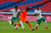 Saudi Arabia's Ali Alhassan, left battles for the ball with Ivory Coast's Max Gradel during a men's soccer match at the 2020 Summer Olympics, Thursday, July 22, 2021, in Sapporo, Japan. (AP Photo/Kiichiro Sato)