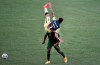 America defender Jorge Sánchez, top, flips over Portland Timbers forward Dairon Asprilla, bottom, during the first half of a CONCACAF Champions League soccer match in Portland, Ore., Wednesday, April 28, 2021. (AP Photo/Steve Dykes)