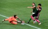 Portland Timbers goalkeeper Steve Clark, left, blocks the shot of Seattle Sounders forward Raul Ruidiaz, right, as Portland Timbers' Jorge Villafana, center, defends during the first half of an MLS soccer match in Portland, Ore., Sunday, Aug. 23, 2020. (AP Photo/Steve Dykes)