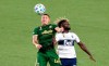 Portland Timbers midfielder Marvin Loria, left, and Vancouver Whitecaps midfielder Leonard Owusu compete for the ball during the first half of an MLS soccer match in Portland, Ore., Sunday, Sept. 27, 2020. (AP Photo/Steve Dykes)
