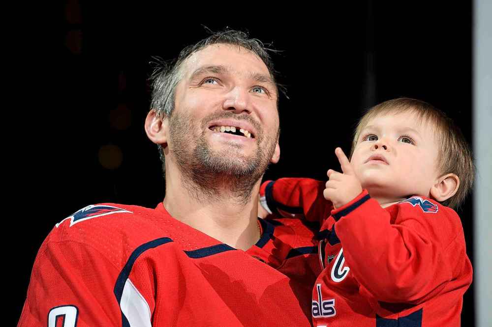 CP
Washington Capitals left wing Alex Ovechkin, of Russia, and son Sergei, right, watch the video screen on the scoreboard during a ceremony to honor Ovechkin for his 700th goal Tuesday, in Washington. (AP Photo/Nick Wass)