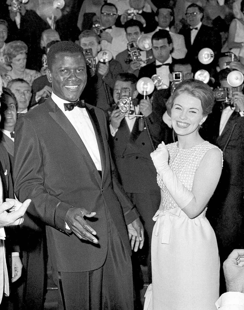 FILE - Actors Sidney Poitier, left, and Jean Seberg appear at the Cannes Film Festival, Cannes, France, for the showing of his film