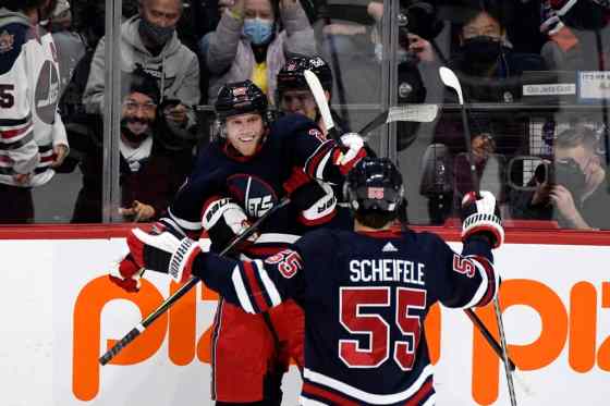 Winnipeg Jets' Nikolaj Ehlers celebrates his goal against the Edmonton Oilers with Andrew Copp and Mark Scheifele during the second period. THE CANADIAN PRESS/Fred Greenslade