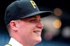 Number one overall pick by the Pittsburgh Pirates in last week's Major League baseball draft, Henry Davis poses for photos on the field at PNC Park before a baseball game between the Pittsburgh Pirates and the New York Mets in Pittsburgh, Sunday, July 18, 2021. The Pirates signed the 21-year-old catcher on Sunday, a week removed from taking him with the first overall pick in the draft. (AP Photo/Gene J. Puskar)