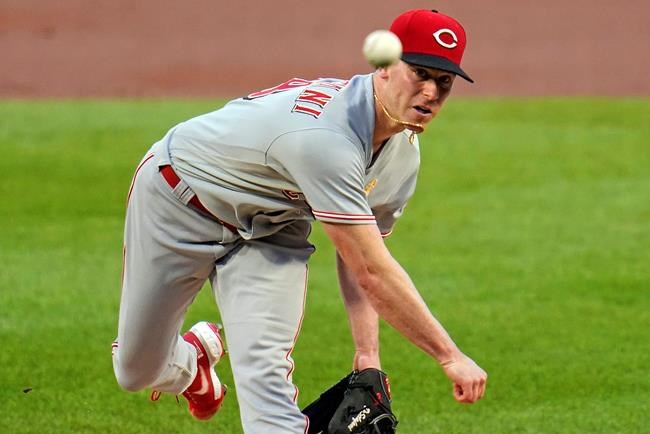 Cincinnati Reds starting pitcher Anthony DeSclafani watches a throw during the first inning of the team's baseball game against the Pittsburgh Pirates in Pittsburgh, Saturday, Sept. 5, 2020. (AP Photo/Gene J. Puskar)