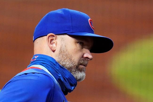 Chicago Cubs manager David Ross stands in the dugout during the first inning of the team's baseball game against the Pittsburgh Pirates in Pittsburgh, Wednesday, Sept. 23, 2020. (AP Photo/Gene J. Puskar)