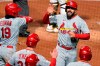 St. Louis Cardinals' Matt Carpenter, top right, returns to the dugout after hitting a three-run home run off Pittsburgh Pirates relief pitcher Duane Underwood Jr. during the sixth inning of a baseball game in Pittsburgh, Friday, April 30, 2021. (AP Photo/Gene J. Puskar)