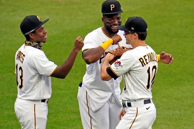 Pittsburgh Pirates' Bryan Reynolds, right, celebrates with Gregory Polanco, center, and Ke'Bryan Hayes after a win over the Chicago Cubs in a baseball game in Pittsburgh, Thursday, Sept. 3, 2020. (AP Photo/Gene J. Puskar)