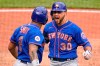 New York Mets' Michael Conforto (30) and Dominic Smith (2) celebrate as they return to the dugout after scoring on Corforto's two-run home run off Pittsburgh Pirates relief pitcher Richard Rodriguez during the ninth inning of a baseball game in Pittsburgh, Sunday, July 18, 2021. (AP Photo/Gene J. Puskar)