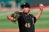 Pittsburgh Pirates starter Derek Holland pitches against the Detroit Tigers in the first inning of a baseball game, Saturday, Aug. 8, 2020, in Pittsburgh. (AP Photo/Keith Srakocic)