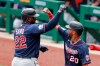 Minnesota Twins' Miguel Sano (22) celebrates with Eddie Rosario (20) after driving him and Jorge Polanco in with a three-run home run in the first inning of a baseball game against the Pittsburgh Pirates, Thursday, Aug. 6, 2020, in Pittsburgh. (AP Photo/Keith Srakocic)