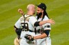 Pittsburgh Pirates relief pitcher Richard Rodriguez (48) is greeted by catcher Jacob Stallings after striking out Kansas City Royals' Michael A. Taylor for the last out in the ninth inning of a baseball game, Tuesday, April 27, 2021, in Pittsburgh. The Pirates won 2-1.(AP Photo/Keith Srakocic)