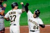Pittsburgh Pirates' Phillip Evans (64) celebrates with Kevin Newman (27) after driving him and Bryan Reynolds in with a three run home run against the Detroit Tigers in the fifth inning of a baseball game, Friday, Aug. 7, 2020, in Pittsburgh. (AP Photo/Keith Srakocic)
