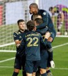 Philadelphia Union's Sergio Santos, top, leaps upon Kacper Przybylko, center of pack, as they celebrate Przybylko's goal on a penalty kick against the Chicago Fire during the first half of an MLS soccer match Wednesday, Oct. 28, 2020, in Chester, Pa. (Charles Fox/The Philadelphia Inquirer via AP)