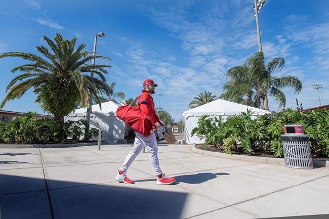 Philadelphia Phillies' Bryce Harper walks to batting practice during spring training baseball practice in Clearwater, Fla., Thursday, Feb. 25, 2021. (Jose F. Moreno/The Philadelphia Inquirer via AP)