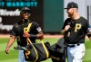 Pittsburgh Pirates third baseman Ke'Bryan Hayes talks with first baseman Todd Frazier as they arrive to take on the Baltimore Orioles in a spring exhibition baseball game, Thursday, March 11, 2021, at LECOM Park in Bradenton, Fla. (Matt Freed/Pittsburgh Post-Gazette via AP)