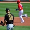 Philadelphia Phillies designated hitter Bryce Harper rounds the bases after hitting a home run off Pittsburgh Pirates pitcher Chad Kuhl in the first inning of a spring training baseball game, Friday, March 5, 2021, at Baycare Ballpark in Clearwater, Fla. (Matt Freed/Pittsburgh Post-Gazette via AP)