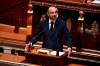 French Prime Minister Edouard Philippe presents his plan to exit from the lockdown at the National Assembly in Paris, Tuesday, April 28, 2020. French Prime Minister Edouard Philippe has outlined a stringent plan to fight coronavirus in France by automatically testing everyone who's come in contact with someone infected with COVID-19. (David Niviere, Pool via AP)
