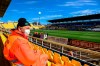 A man wears a mask as he sits in the stands ahead of a Serie A soccer match between Parma and Spal was scheduled to be played, in Parma, northern Italy, Sunday, March 8, 2020. Parma and Spal players were ready to enter the field at Ennio Tardini stadium in Parma when they received the news that Italy’s sports minister Vincenzo Spadafora said that the country’s football federation should consider suspending the games. (Piero Cruciatti/LaPresse via AP)