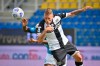 Napoli's Victor Osimhen, left, competes for the ball with Simone Iacoponi uring the Serie A soccer match between Parma and Napoli at the Ennio Tardini stadium in Parma, Italy, Sunday, Sept. 20, 2020. (Massimo Paolone/LaPresse via AP)