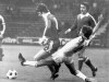 -FILE- In this August 17, 1976, file image, Anderlecht player Rob Rensenbrink, right, stretches to push the ball away during the Super Cup soccer match between FC Bayern Munich and RSC Anderlecht, in Munich, Germany. Behind Rensenbrink are FC Bayern players Rainer Kuenkel and Udo Horsmann. Rensenbrink, the forward who was centimeters away from delivering the Netherlands a World Cup title in 1978 has died at age 72, the Dutch football association said Saturday, Jan. 25, 2020. (AP Photo/D. Hampe, File)