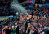 Manchester City's Kyle Walker sprays liquid in the air prior to the League Cup soccer match final between Aston Villa and Manchester City, at Wembley stadium, in London, England, Sunday, March 1, 2020. (AP Photo/Ian Walton)