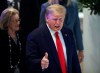 U.S. President Donald Trump flashes a thumbs-up as he arrives at the World Economic Forum in Davos, Switzerland, Wednesday, Jan. 22, 2020. The 50th annual meeting of the forum is taking place in Davos from Jan. 21 until Jan. 24, 2020. (AP Photo/Michael Probst)