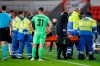 PSV's Richard Ledezma is carried off the pitch with an injury during the group E Europa League soccer match between PSV and Omonia at the Philips stadium in Eindhoven, Netherlands, Thursday, Dec. 10, 2020. (AP Photo/Peter Dejong)