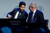 Nasser Al-Khelaifi, left, talks to Lars-Christer Olsson, right, during a meeting of European soccer leaders at the congress of the UEFA governing body in Amsterdam's Beurs van Berlage, Netherlands, Tuesday, March 3, 2020. (AP Photo/Peter Dejong)
