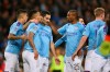 Manchester City players celebrate with Ilkay Gundogan, center, after he scored his side's first goal during the group C Champions League soccer match between Manchester City and Shakhtar Donetsk at the Etihad Stadium in Manchester, England, Tuesday, Nov. 26, 2019. (AP Photo/Dave Thompson)