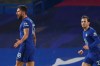 Chelsea's Ben Chilwell, right, runs to celebrate with Olivier Giroud, left, who scored his side's first goal during the English Premier League soccer match between Chelsea and Aston Villa in London, England, Monday, Dec. 28, 2020. (Richard Heathcote/Pool via AP)