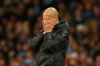 Manchester City's head coach Pep Guardiola covers his face during the group C Champions League soccer match between Manchester City and Shakhtar Donetsk at the Etihad Stadium in Manchester, England, Tuesday, Nov. 26, 2019. (AP Photo/Dave Thompson)