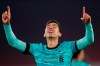 Liverpool's Roberto Firmino celebrates scoring his side's second goal during the English Premier League soccer match between Sheffield United and Liverpool at Bramall Lane stadium in Sheffield, England, Sunday, Feb. 28, 2021. (Lee Smith, Pool via AP)