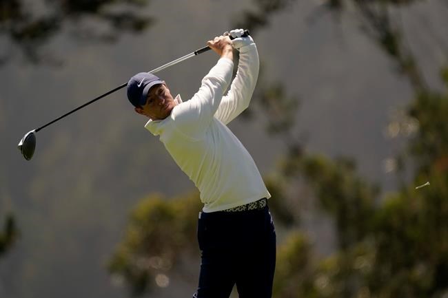 Rory McIlroy of Northern Ireland, watches his tee shot on the fourth hole during the second round of the PGA Championship golf tournament at TPC Harding Park Friday, Aug. 7, 2020, in San Francisco. (AP Photo/Jeff Chiu)