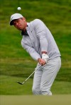 Paul Casey of England, chips to the green on the 13th hole during the final round of the PGA Championship golf tournament at TPC Harding Park Sunday, Aug. 9, 2020, in San Francisco. (AP Photo/Jeff Chiu)