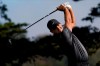 Patrick Reed watches his tee shot on the 14th hole during the first round of the PGA Championship golf tournament at TPC Harding Park Thursday, Aug. 6, 2020, in San Francisco. (AP Photo/Jeff Chiu)