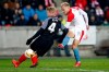 FILE _ In this file photo taken on Thursday, March 14, 2019, Slavia's Mick van Buren, right, scores his side's third goal past Sevilla's Simon Kjaer, left, during the Europa League Round of 16 second leg soccer match between Slavia Praha and Sevilla at the Sinobo stadium in Prague, Czech Republic. On Monday Jan. 13, 2020, Slavia Prague forward Mick van Buren moved to ADO Den Haag in the top Dutch league on loan till the end of the season. (AP Photo/Petr David Josek/File)