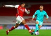 Liverpool's Thiago, right, challenges Arsenal's Pierre-Emerick Aubameyang during the English Premier League soccer match between Arsenal and Liverpool at the Emirates Stadium in London, England, Saturday, April 3, 2021. (Julian Finney/Pool via AP)