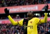 Watford's Abdoulaye Doucoure gestures after missing a chance to score during the English Premier League soccer match between Liverpool and Watford at Anfield stadium in Liverpool, England, Saturday, Dec. 14, 2019. (AP Photo/Rui Vieira)