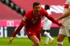 Bayern's Robert Lewandowski celebrates after scoring his sides first goal during the German Bundesliga soccer match between FC Bayern Munich and VfB Stuttgart in Munich, Germany, Saturday, March 20, 2021. (Matthias Schrader/Pool via AP)