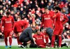 Liverpool's Georginio Wijnaldum is treated for injury during the English Premier League soccer match between Liverpool and Watford at Anfield stadium in Liverpool, England, Saturday, Dec. 14, 2019. (AP Photo/Rui Vieira)