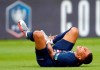 PSG's Kylian Mbappe shouts in pain after being tackled during the French Cup soccer final match between Paris Saint Germain and Saint Etienne at Stade de France stadium, in Saint Denis, north of Paris, Friday July 24, 2020. (AP Photo/Francois Mori)
