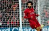 Liverpool's Mohamed Salah celebrates after scoring his sides third goal during the English Premier League soccer match between Liverpool and Southampton at Anfield Stadium, Liverpool, England, Saturday, February 1, 2020. (AP Photo/Jon Super)