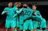 Liverpool's Mohamed Salah celebrates with teammates after scoring his sides second goal during the English Premier League soccer match between Arsenal and Liverpool at the Emirates Stadium in London, England, Saturday, April 3, 2021. (Catherine Ivill/Pool via AP)