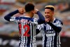 West Bromwich Albion's Matheus Pereira, left, celebrates with West Bromwich Albion's Callum Robinson after scoring from a penalty his sides third goal during the English Premier League soccer match between Wolverhampton Wanderers and West Bromwich Albion at the Molineux Stadium in Wolverhampton, England, Saturday, Jan. 16, 2021. (Adrian Dennis/Pool via AP)