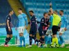 PSG's Angel Di Maria, left, sees a red card during the Champions League semifinal second leg soccer match between Manchester City and Paris Saint Germain at the Etihad stadium, in Manchester, Tuesday, May 4, 2021. (AP Photo/Dave Thompson)