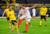Dortmund's Emre Can, left, challenges Sevilla's Luuk de Jong during the Champions League, round of 16, second leg soccer match between Borussia Dortmund and Sevilla FC in Dortmund, Germany, Tuesday, March 9, 2021. (Bernd Thissen/Pool via AP)