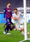 Bayern's Joshua Kimmich celebrates after scoring his sides fifth goal during the Champions League quarterfinal match between FC Barcelona and Bayern Munich at the Luz stadium in Lisbon, Portugal, Friday, Aug. 14, 2020. (AP Photo/Manu Fernandez/Pool)